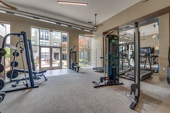 Fitness center with strength training equipment and cable stations